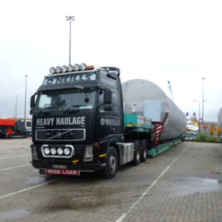 Transporting large tank on a flatbed lorry